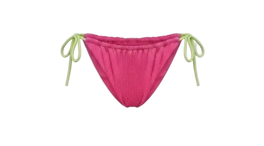 Minimalist Amalfi Dream Bikini Bottoms by ÁMBER DEL MAR in pink with lime green side-ties that is preppy and coastal chic aesthetic summer swimwear.