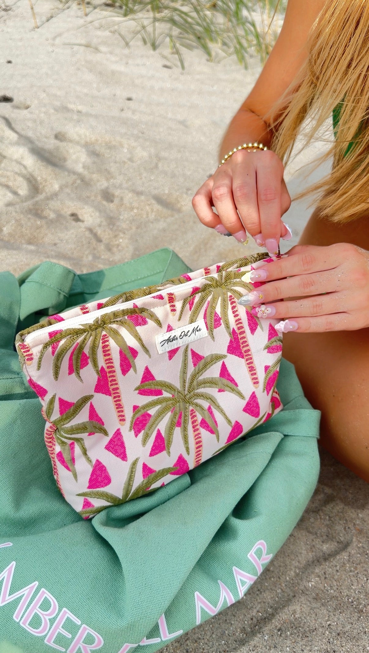 100% cotton canvas pouch with embroidered green palm trees and pink trim by Ámber Del Mar.